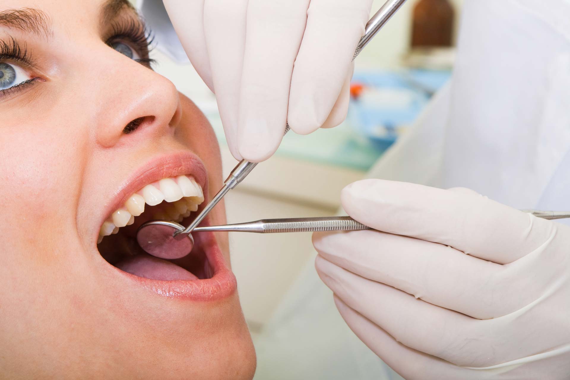 a woman being examined by dentist