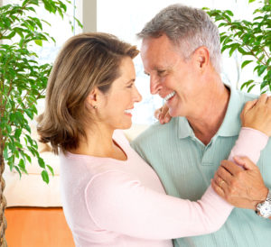 two older patients smiling at each other