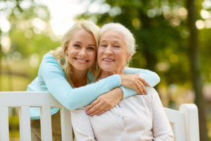 Happy mother and daughter smiling after root canal therapy