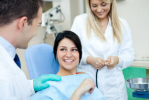 relaxed female patient smiling at dentist after using nitrous oxide 