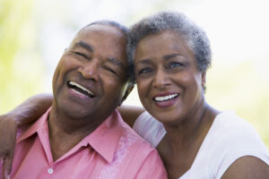 Happy African American senior couple smiling 